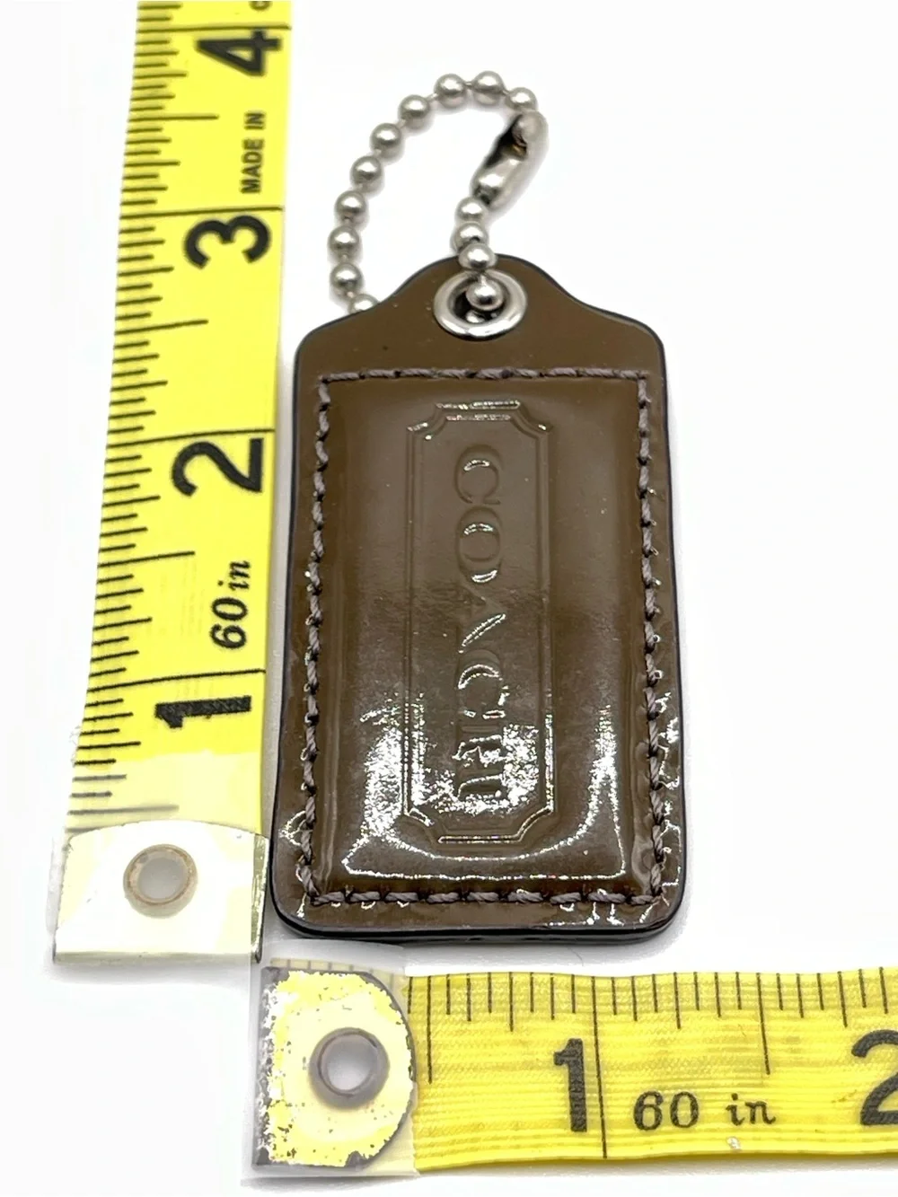 COACH Patent Leather Hang Tag Brown and Iridescent Gray